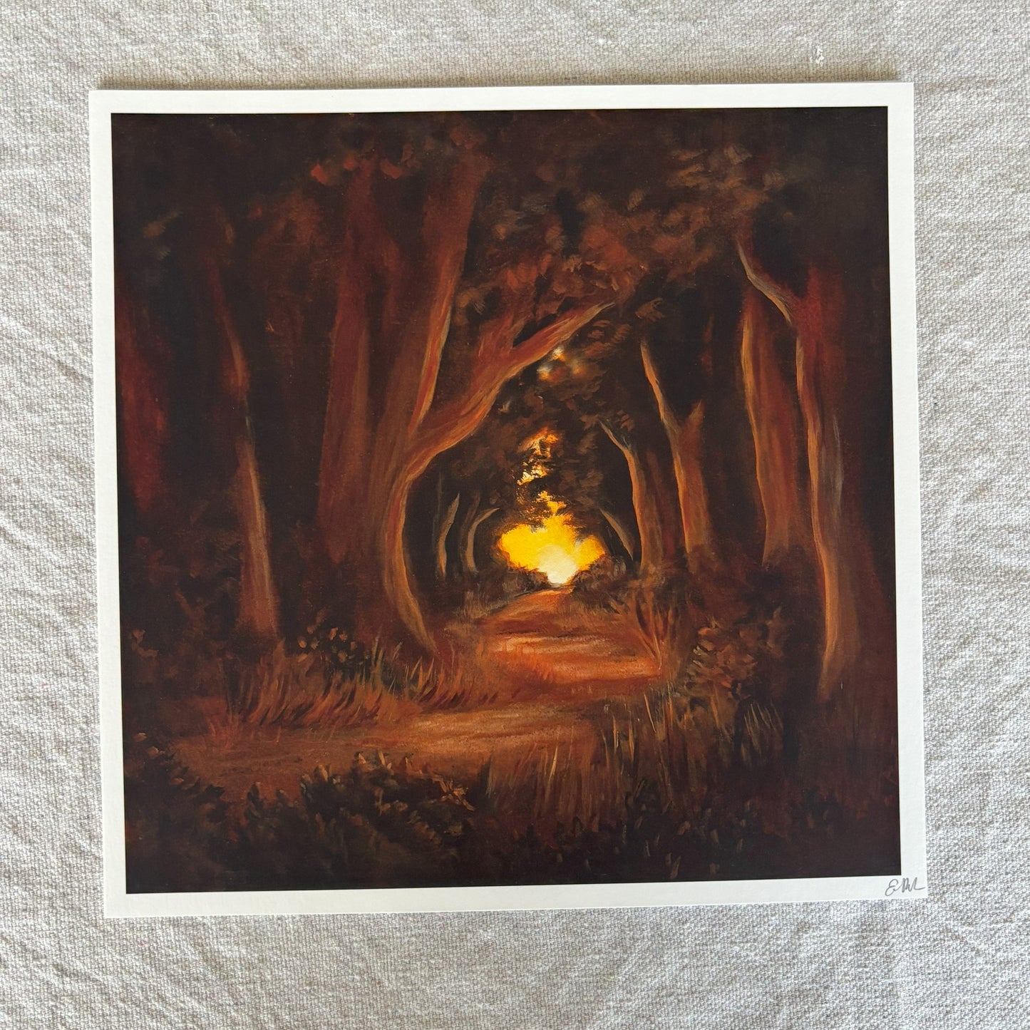 Art print of a forest scene with a glowing light at the end on a textured gray background