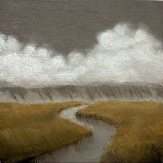 Square photograph of a landscape with a river and clouds on textured paper.